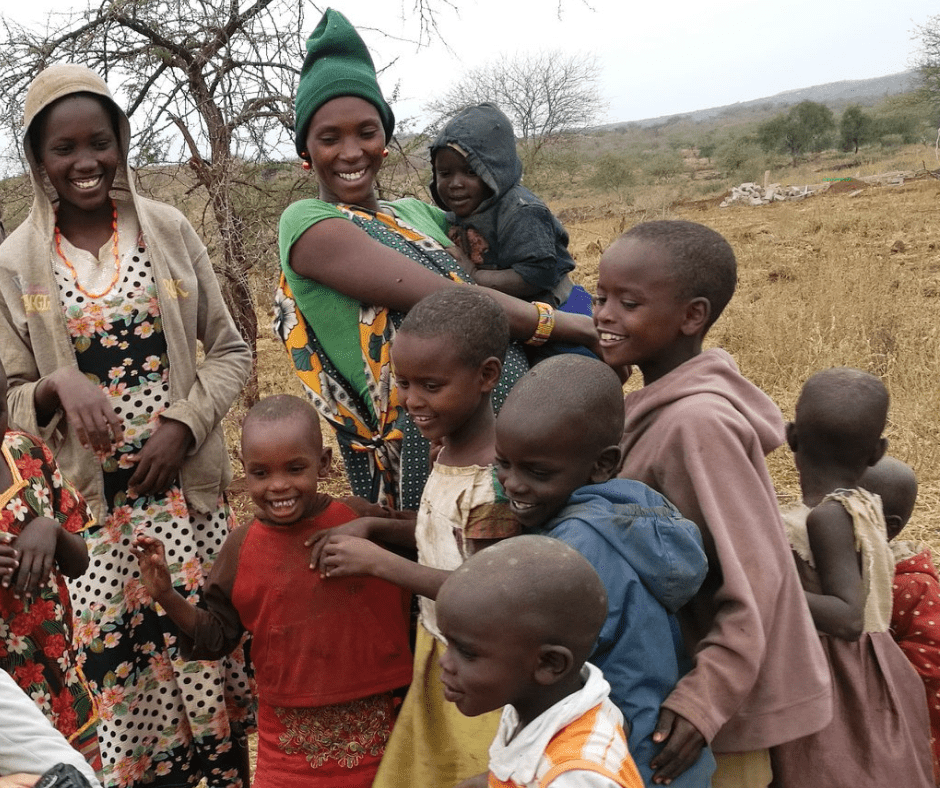 Maasai women and children waiting to receive food aid.